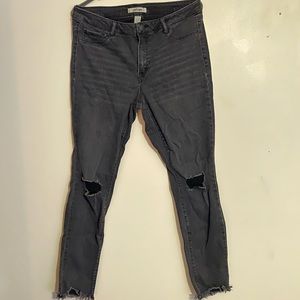Distressed black skinny jeans